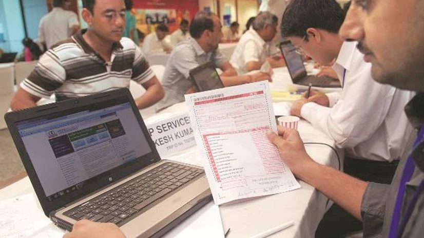 People filing income returns at income tax office People filing income returns at income tax office