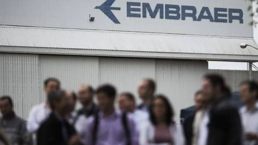File photo of employees of Embraer's main aircraft factory holding an assembly outside their workplace in Sao Jose dos Campos.(Photo: Reuters) Embraer