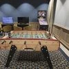 A foosball table and a pinball machine at a games area inside the lounge. Photo: Bloomberg