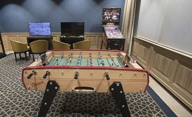 A foosball table and a pinball machine at a games area inside the lounge. Photo: Bloomberg A foosball table and a pinball machine at a games area inside the lounge. Photo: Bloomberg