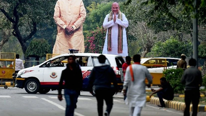 Giant cut-outs of Prime Minister Narendra Modi and BJP President Amit Shah fixed at the party headquarters Giant cut-outs of Prime Minister Narendra Modi and BJP President Amit Shah fixed at the party headquarters