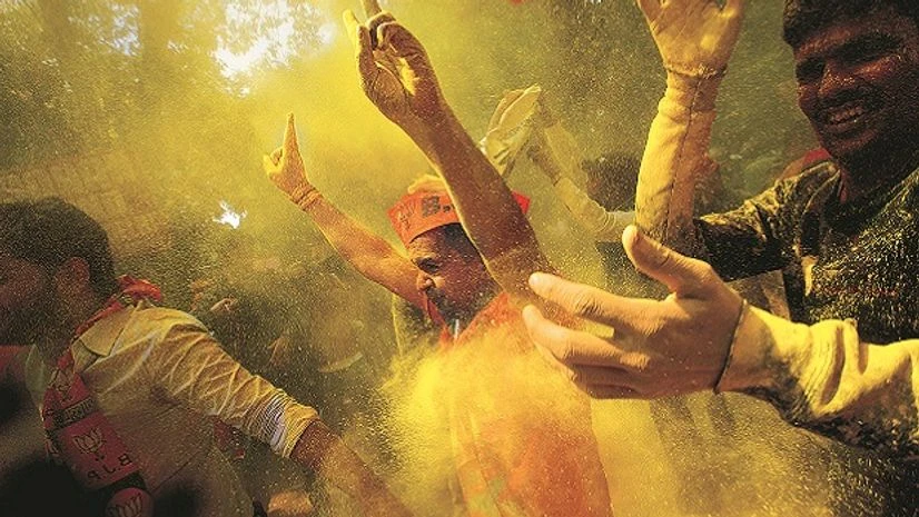 Bharatiya Janata Party (BJP) workers celebrate the victory of their party in Uttar Pradesh and Uttarakhand, in New Delhi on Saturday. Though BJP failed to win Punjab or get a majority in Goa and Manipur, its return to power in pivotal UP is a major b Bharatiya Janata Party (BJP) workers celebrate the victory of their party in Uttar Pradesh and Uttarakhand, in New Delhi on Saturday. Though BJP failed to win Punjab or get a majority in Goa and Manipur, its return to power in pivotal UP is a major b