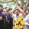 Congress candidate Dayanand Raghunath Sopte  (centre) celebrates after defeating BJP leader and Goa Chief Minister Laxmikant Parsekar
