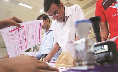 Details: ITR form simplified further; e-filing to start from April People filing income tax returns form