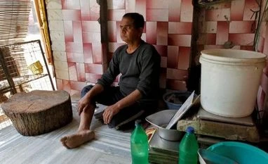 Nothing can save illegal slaughterhouses from shutting down, says Centre A meat vendor sits inside his shop