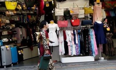 Japan's tepid retail sales raise concerns about consumption, growth A woman in a kimono walks past a shop in a shopping district in Tokyo, Japan Photo: Reuters