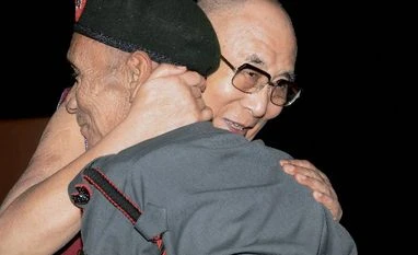 India will pay 'dearly' if it plays Dalai Lama card: Chinese daily Tibetan spiritual leader Dalai Lama with Naren Chandra Das, a retired havildar of 5 Assam Rifles during Namami Brahmaputra festival in Guwahati on Sunday. Das is a lone survivor of the seven Indian personnel who received Dalai Lama on the Indian soil