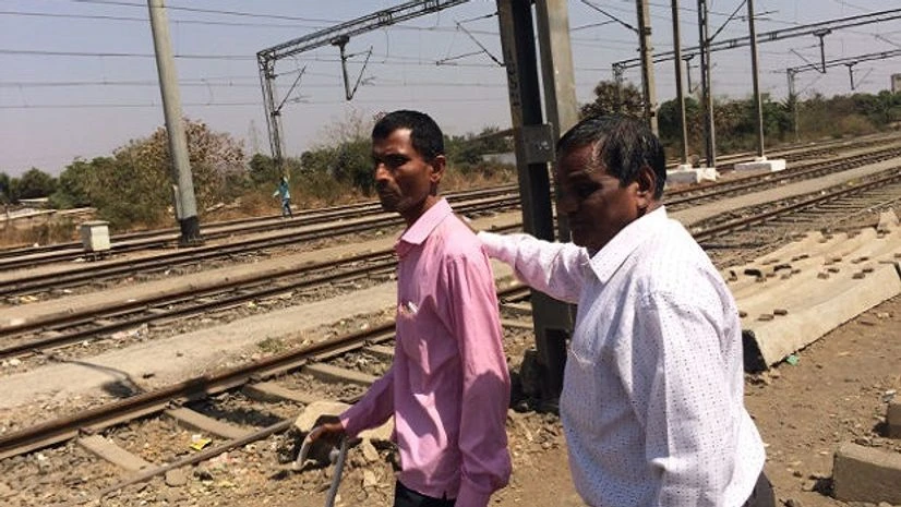 blind Munjaba Shingare (in pink) and Sawlaram Vaje (in white) are part of the 300-strong community of visually impaired people living in Vangani in Maharashtra’s Thane district.
