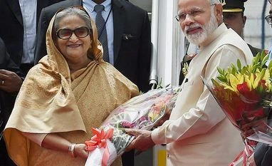 Narendra Modi, Sheikh Hasina to hold delegation level talks today File photo of Narendra Modi and Sheikh Hasina