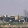 This frame grab from video provided by the Syrian official TV, a Syrian government channel that is consistent with independent AP reporting, shows the burned and damaged hangar warplanes which attacked by U.S. Tomahawk missiles, at the Shayrat Syrian
