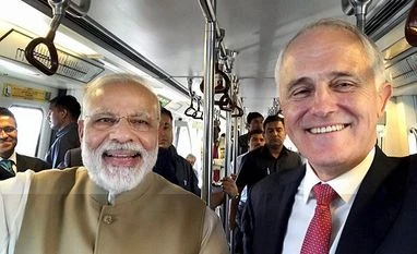 Australian visa move unlikely to impact Indian IT workers: Nasscom Prime Minister Narerndra Modi along with his Australian counterpart Malcolm Turnbull travel in Metro train in New Delhi on Monday. Photo: PTI