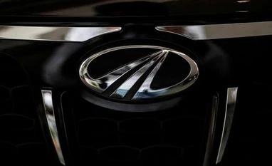 M&M rallies 6% post Q4 on robust outlook for FY18; top index gainer The logo of Mahindra and Mahindra is seen on a car at a showroom in Mumbai, India