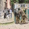 Youths throw stones on Security forces during clashes in Srinagar on Sunday. Four civilians where killed and more than two dozens were injured during the clashes. Photo: PTI