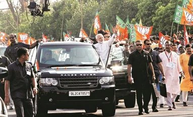 Stay in battle mode for elections: Amit Shah Prime Minister Narendra Modi during a roadshow in Bhubaneswar on Saturday. PTI: Photo