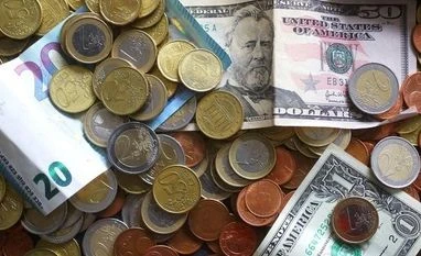 Forex reserves increase by $889.4 mn to $369.887 bn An illustration picture shows euro and US dollar banknotes and coins