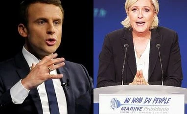 French election: Emmanuel Macron to fight Marine Le Pen in second round Emmanuel Macron (left), Marine Le Pen