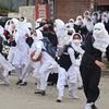 Girl students pelt stones at security personnel during clashes in the vicinity of Lal Chowk in Srinagar