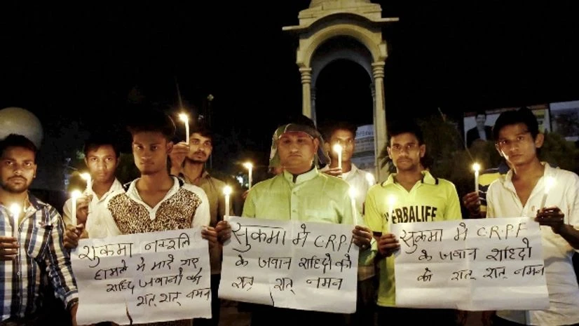 LJP activists take part in a candle light vigil to pray for CRPF jawans lost their lives in a Naxal attack in Chhattisgarh's Sukma district LJP activists take part in a candle light vigil to pray for CRPF jawans lost their lives in a Naxal attack in Chhattisgarh's Sukma district