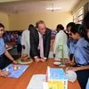 Richard Northcote (centre), CSO, Covestro AG, interacting with  students at the mini science centre