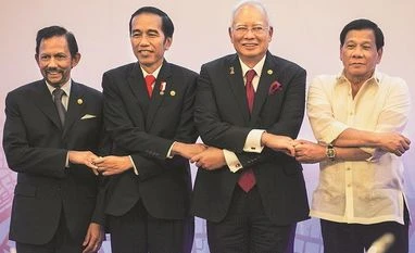China scores tacit victory at Asean on South China Sea (From left) Brunei's Sultan Hassanal Bolkiah, Indonesia's President Joko Widodo, Malaysia's Prime Minister Najib Razak and Philippine's President Rodrigo Duterte link hands during the 12th ASEAN Growth Area Summit in Manila (Photo: Reuters)