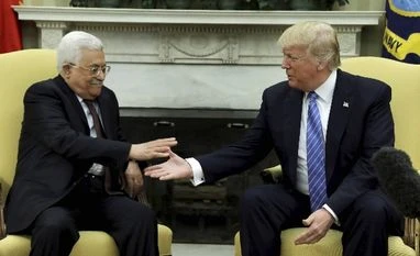 Donald Trump vows to mediate peace between Israel, Palestine President Donald Trump reaches to shakes hands with Palestinian leader Mahmoud Abbas in the Oval Office of the White House in Washington