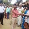 Jashpur District Collector Priyanka Shukla (left) with Anoop Bhagat, who visited his village after securing sixth position in the board exam