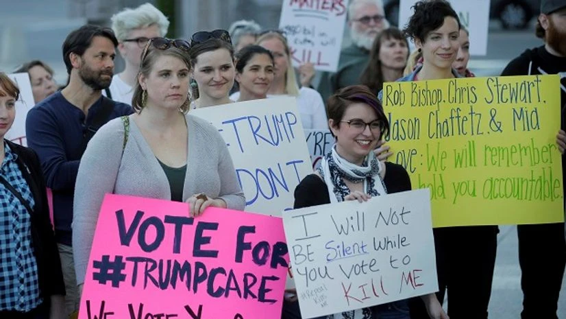 People look on during a healthcare rally Thursday, May 4, 2017, in Salt Lake City. Utah's all-Republican House delegation voted Thursday in favor of a health care overhaul that could impact people with pre-existing conditions, triggering serious worr People look on during a healthcare rally Thursday, May 4, 2017, in Salt Lake City. Utah's all-Republican House delegation voted Thursday in favor of a health care overhaul that could impact people with pre-existing conditions, triggering serious worr