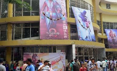 Over Rs 1,500 cr in 25 days: Milestones galore in Baahubali 2 golden run Movie fans at a theatre in Bengaluru to watch the “Bahubali 2: The Conclusion” (Photo: PTI)