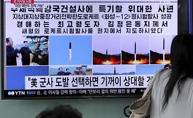 North Korea warns South Korea for condemning ballistic missile test Woman walks by a TV news program showing images of North Korean leader Kim Jong Un and the missile launch, published in the country's Rodong Sinmun newspaper, at Seoul Railway station in Seoul, South Korea. File Photo: PTI