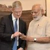Indian Prime Minister Narendra Modi, right, and Apple CEO Tim Cook with an iPhone last May. Photo: Press Information Bureau