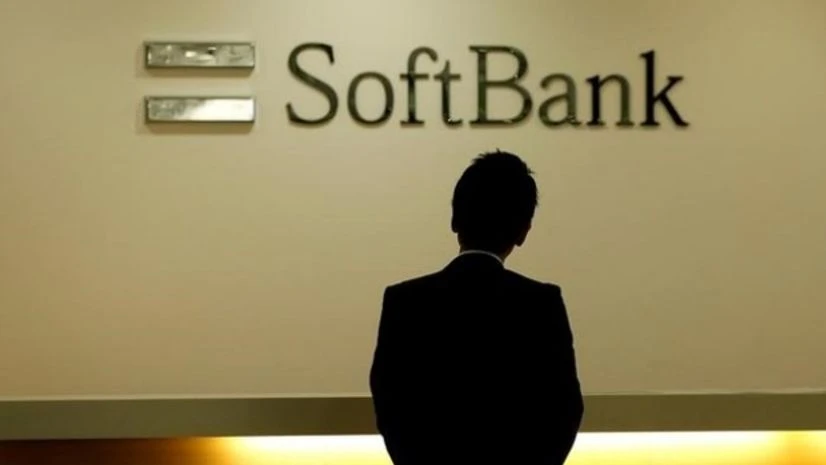 A man looks at the logo of SoftBank Group Corp at the company's headquarters in Tokyo Softbank