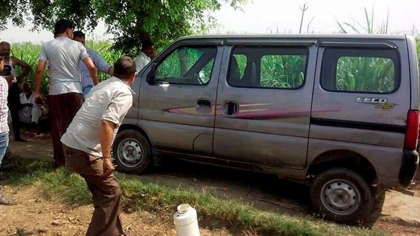 Police investigates near the vehicle, in which seven members of family along with a driver were travelling while being attacked by a group of at least five criminals on Jewar-Bulandshahr road off Yamuna Expressway. Photo: PTI Police investigates near the vehicle, in which seven members of family along with a driver were travelling while being attacked by a group of at least five criminals on Jewar-Bulandshahr road off Yamuna Expressway. Photo: PTI