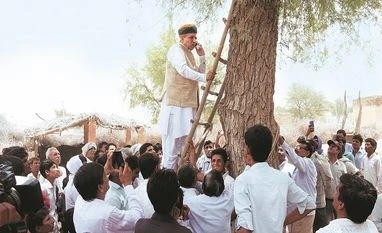 Union Minister Arjun Ram Meghwal scales a tree to make a call Arjun Ram Meghwal