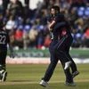 England's Mark Wood celebrates taking the wicket of New Zealand's Kane Williamson, left, during the ICC Champions Trophy, Group A cricket match between England and New Zealand in Cardiff, Wales. Photo: AP/PTI