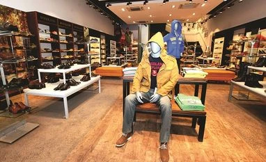 Woodland banks on retail expansion to double sales to Rs 2,500 cr by 2025 Woodland store, sports, sport shoes, mannequin