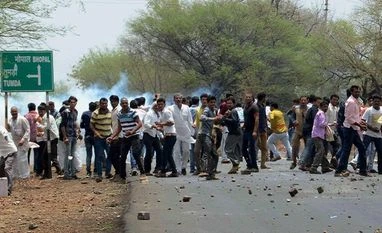 Police firings killed 2 Indian civilians a week on average between 2009-15 Farmers pelting stones as they clash with the police during their agitation in Phanda near Bhopal