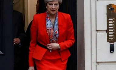 Theresa May attacks unacceptable face of capitalism in Britain Theresa May