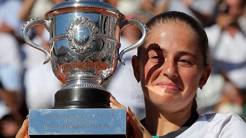 Latvia's Jelena Ostapenko holds the cup after defeating Romania's Simona Halep in their final match of the French Open tennis tournament at the Roland Garros stadium Latvia's Jelena Ostapenko holds the cup after defeating Romania's Simona Halep in their final match of the French Open tennis tournament at the Roland Garros stadium