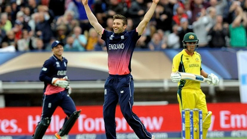 England, cricket England's Mark Wood celebrates after bowling Australia's Glenn Maxwell caught by England's Jason Roy for 20 runs during an ICC Champions Trophy match between England and Australia at Edgbaston. Photo: PTI