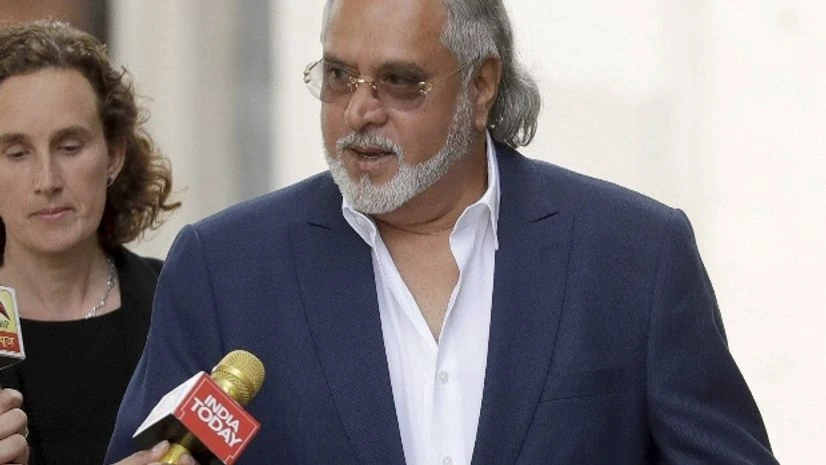 Former Indian politician and billionaire businessman Vijay Mallya, centre, arrives for his extradition hearing arrives at Westminster Magistrates Court in London. Former Indian politician and billionaire businessman Vijay Mallya, centre, arrives for his extradition hearing arrives at Westminster Magistrates Court in London.