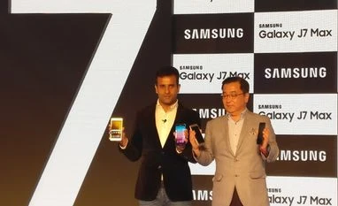Samsung unveils Galaxy J7 Pro, J7 Max; brings Samsung Pay to more devices (R) Ken Kang, MD and Head, Mobile Business, Samsung India and Sumit Walia, Director Mobile Business, Samsung to launch the Samsung Galaxy J7 Pro and Galaxy J7 Max smartphones during a press conference in New Delhi on Wednesday