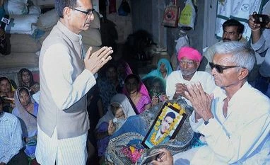 Shivaraj Singh Chauhan, farmer, Madhya Pradesh Chief Minister Shivraj Singh Chouhan meeting the farmer's family, killed in police firing. Photo: PTI