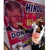 Hindu Sena chief Vishnu Gupta offering cake to the photo of US President Donald Trump while celebrating his birthday at Jantar Mantar. Photo: PTI