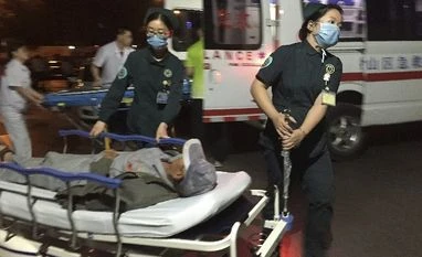 China kindergarten blast suspect under police scanner; death toll at eight In this photo released by China's Xinhua News Agency, medical workers transport a person injured in an explosion outside a kindergarten into a hospital in Fengxian County in eastern China's Jiangsu Province early Friday