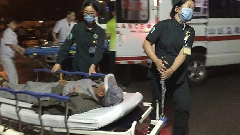 In this photo released by China's Xinhua News Agency, medical workers transport a person injured in an explosion outside a kindergarten into a hospital in Fengxian County in eastern China's Jiangsu Province early Friday In this photo released by China's Xinhua News Agency, medical workers transport a person injured in an explosion outside a kindergarten into a hospital in Fengxian County in eastern China's Jiangsu Province early Friday
