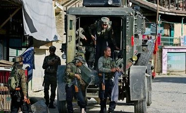 Encounter breaks out between security forces, militants in J&K's Anantnag Army jawans stand guard during an encounter with militants at Arwani village of Anantnag district of South Kashmir on Friday. Two youth were killed and nearly a dozen others injured as security forces opened firing to chase away stone-pelting protest