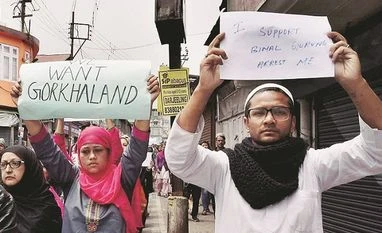 Arson in Kalimpong; GJM marches with bodies GJM activists, Darjeeling, protestors