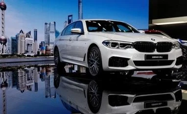 Auto supplier Magna to manufacture BMW 5-series plug-in hybrids A BMW 5-Series Li car is displayed at the Shanghai Auto Show during its media day, in Shanghai, China. (Photo: Reuters)