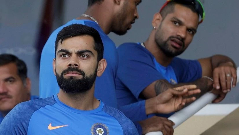 India's captain Virat Kohli looks at the field from the pavilion as the start of the second ODI cricket match against West Indies is delayed due to rain at Queen's Park Oval in Port of Spain, Trinidad and Tobago, Sunday, June 25. Photo: AP/PTI India's captain Virat Kohli looks at the field from the pavilion as the start of the second ODI cricket match against West Indies is delayed due to rain at Queen's Park Oval in Port of Spain, Trinidad and Tobago, Sunday, June 25. Photo: AP/PTI
