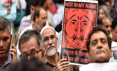 Gau rakshak beat two for carrying beef in MP; police arrest victims too Not in my name protest, mob lynching